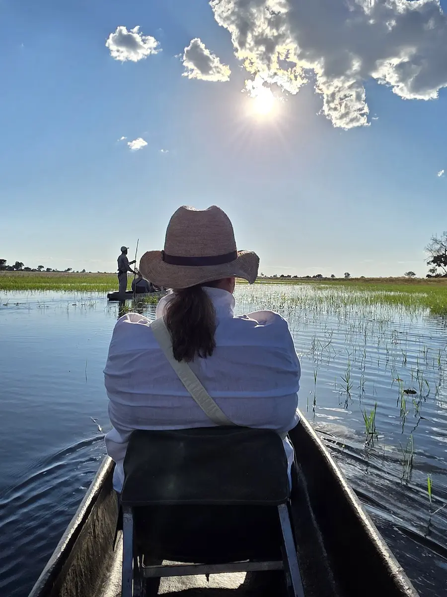 African Okavango Delta Safari Sandra in hollow boat traveling on the Okavango Delta
